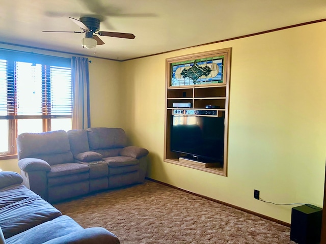 living room featuring ceiling fan and carpet