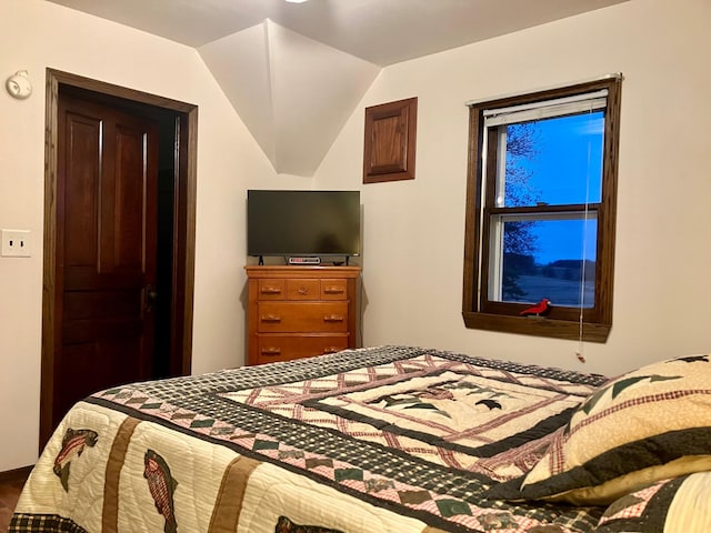 bedroom with lofted ceiling