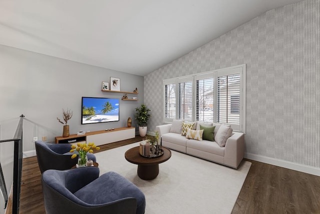 living room with hardwood / wood-style flooring and lofted ceiling