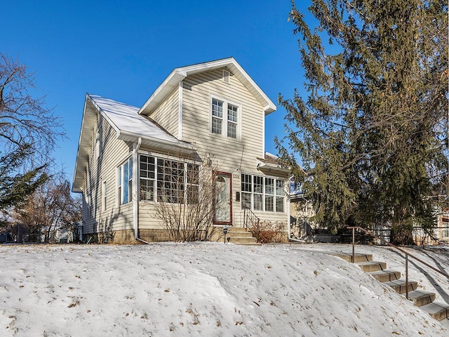 front of property with a sunroom