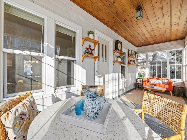 sunroom featuring wood ceiling and a jacuzzi