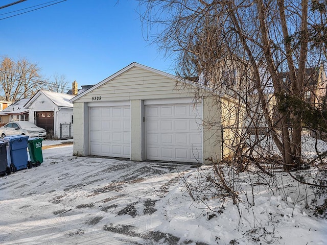 view of snow covered garage