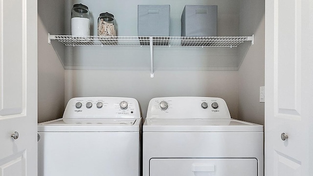 washroom with washer and dryer