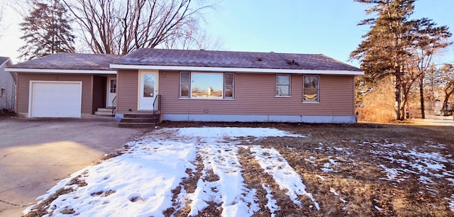 single story home featuring a garage