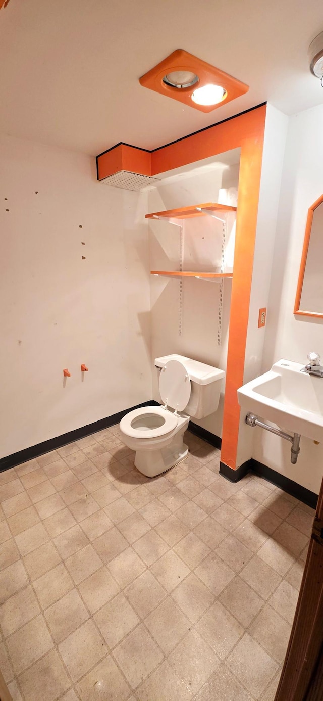 bathroom featuring sink and toilet