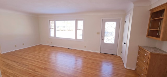 entryway with light hardwood / wood-style flooring