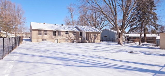 view of snow covered house