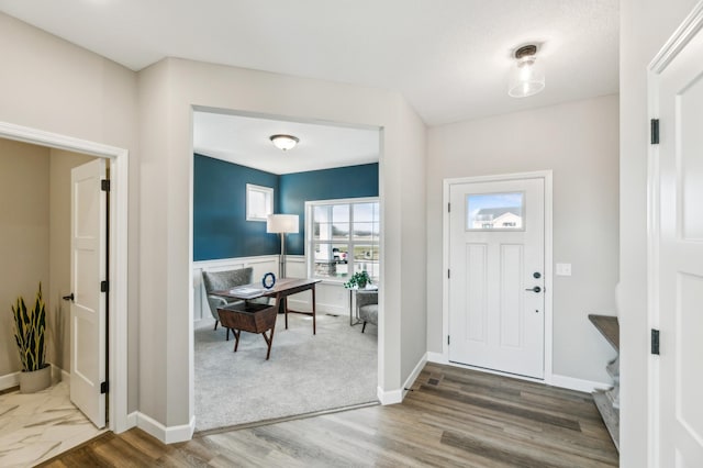 entryway with hardwood / wood-style floors