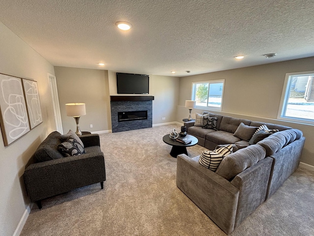 carpeted living room featuring a textured ceiling