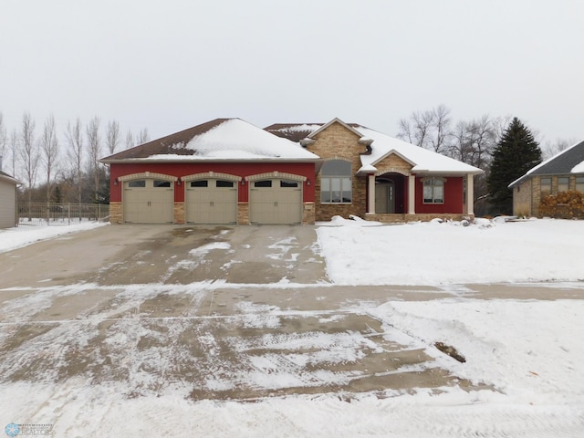 single story home featuring a garage