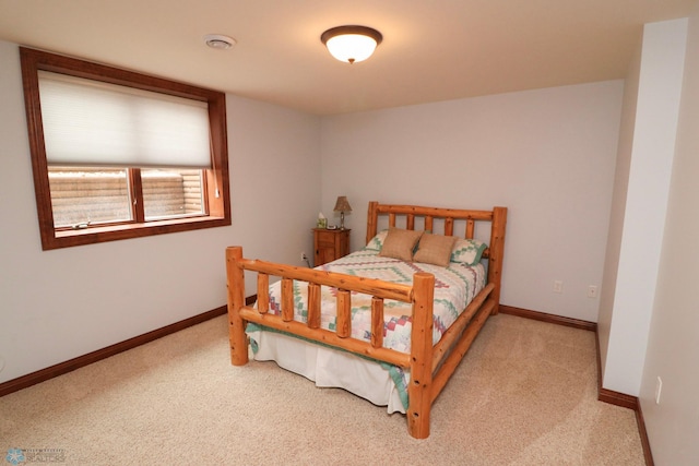 bedroom with light carpet