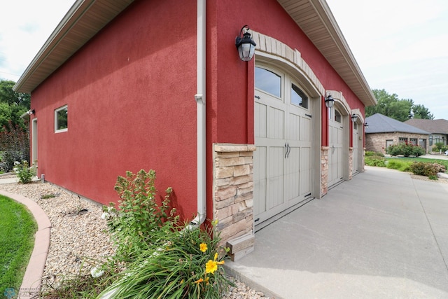 view of side of property with a garage