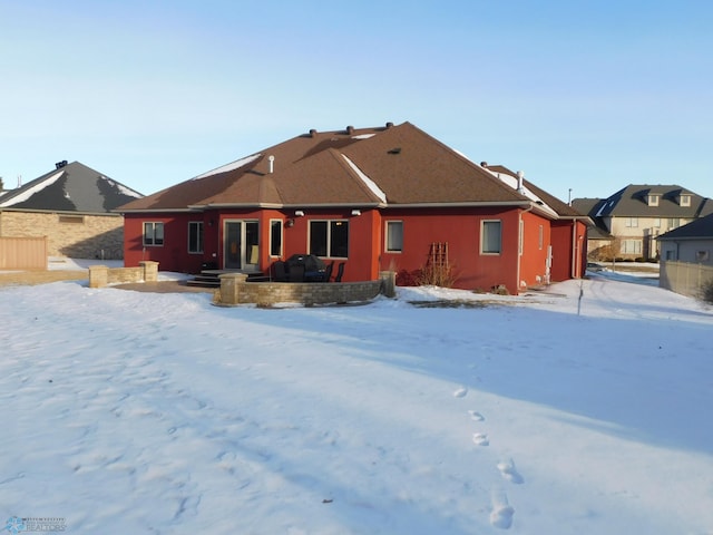 view of snow covered house