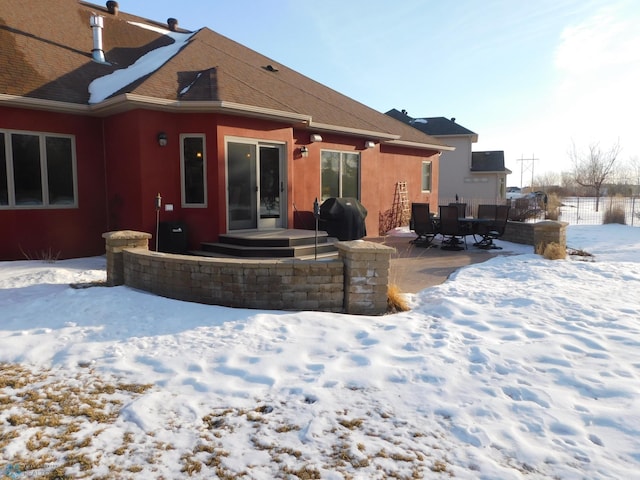 view of snow covered house