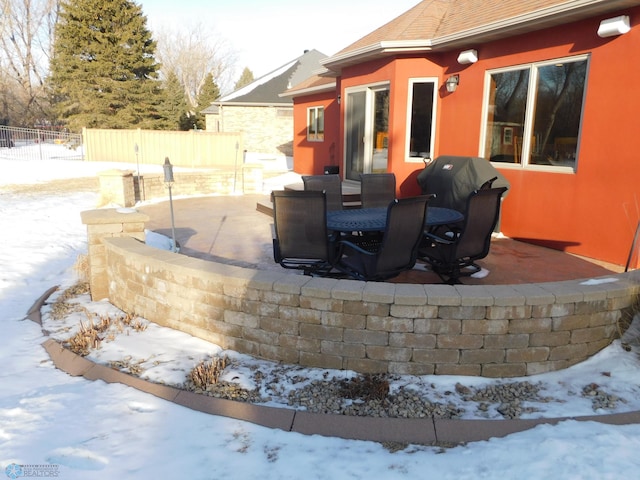 view of snow covered patio