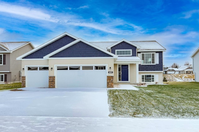 view of front of home with a garage and a front yard