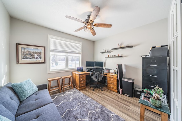 office space featuring wood-type flooring and ceiling fan