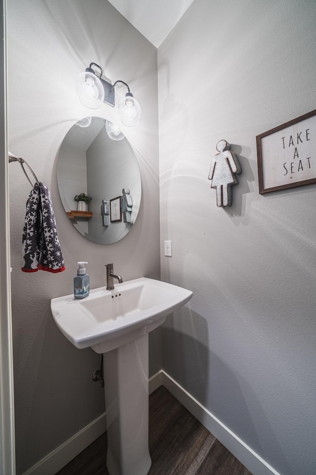 bathroom featuring sink and hardwood / wood-style flooring