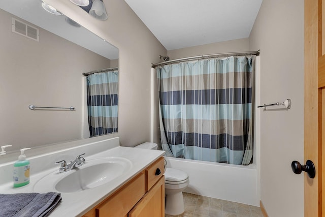 full bathroom with vanity, shower / tub combo with curtain, and toilet