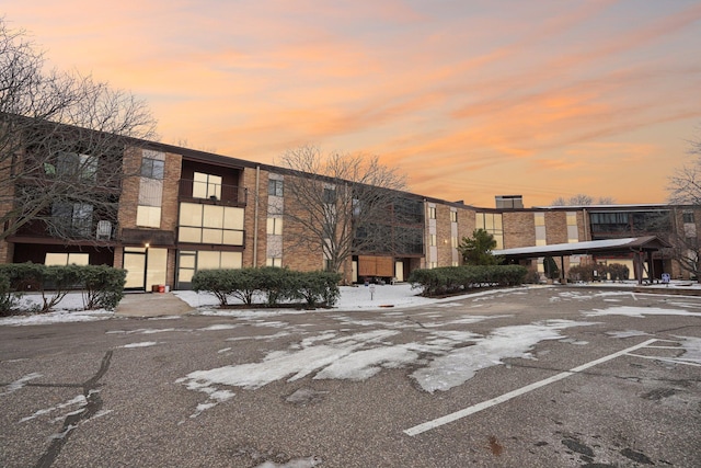 view of outdoor building at dusk