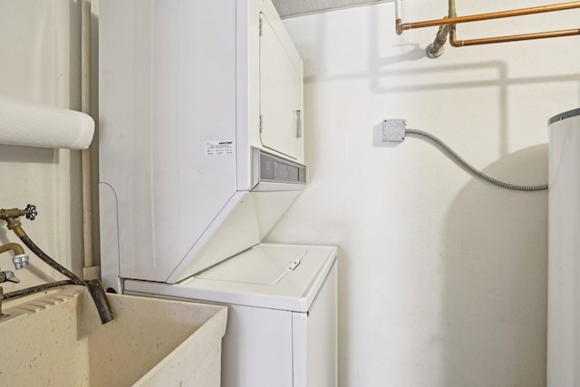 washroom featuring sink and stacked washing maching and dryer