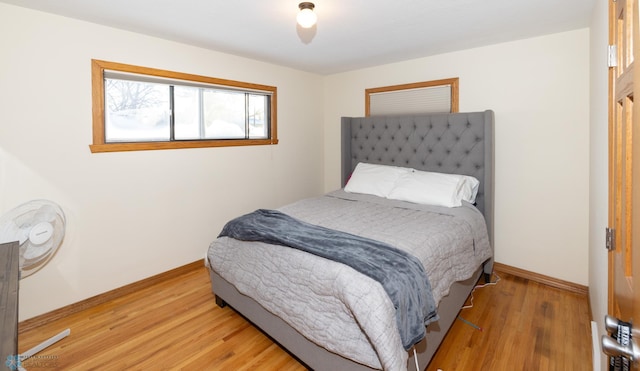 bedroom with wood-type flooring