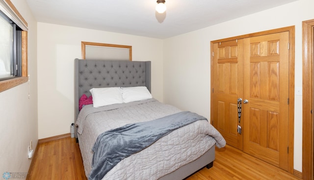 bedroom featuring light hardwood / wood-style flooring and a closet