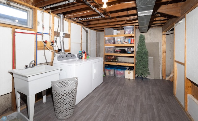 laundry area featuring dark hardwood / wood-style floors and washer and dryer