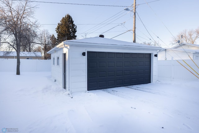 view of snow covered garage