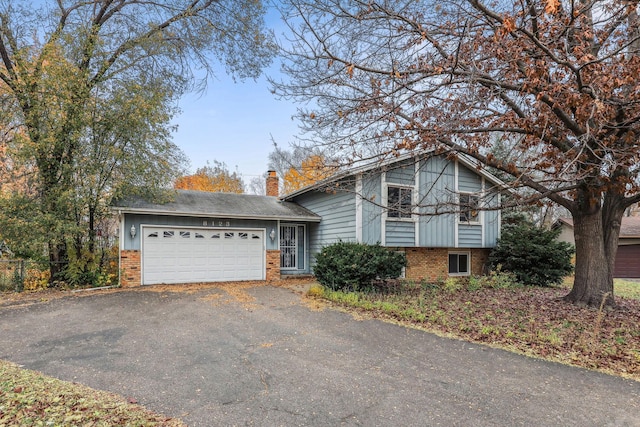 split level home with a garage