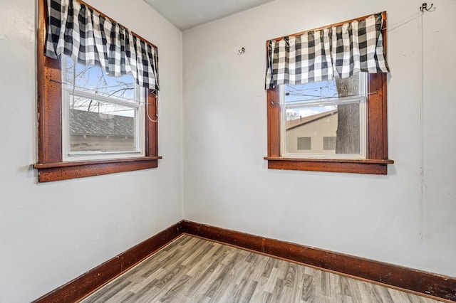 empty room with hardwood / wood-style flooring