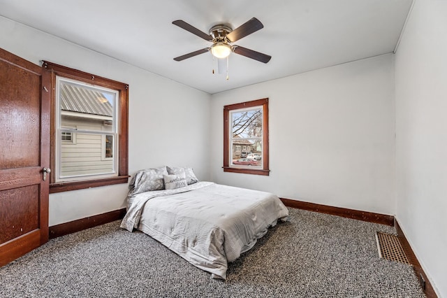 bedroom featuring ceiling fan and carpet floors