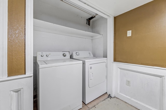 clothes washing area featuring washer and clothes dryer