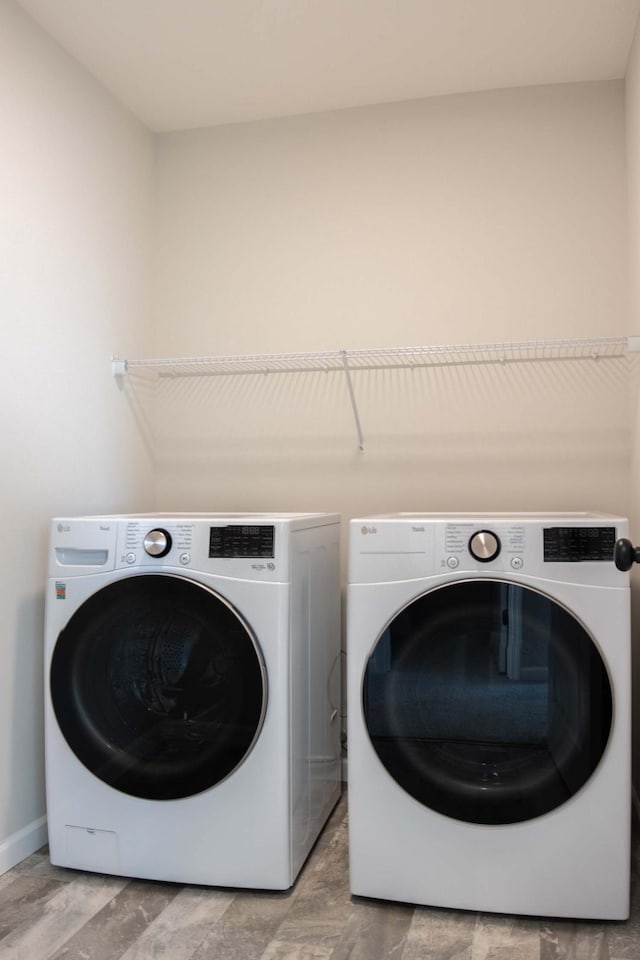 14554 Kingsview Ln N, Dayton, MN 55327 - washroom featuring independent washer and dryer and baseboards
