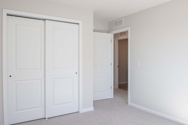 14554 Kingsview Ln N, Dayton, MN 55327 - unfurnished bedroom with light carpet, a closet, and baseboards