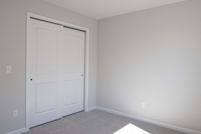 14554 Kingsview Ln N, Dayton, MN 55327 - unfurnished bedroom with carpet floors, a closet, and baseboards