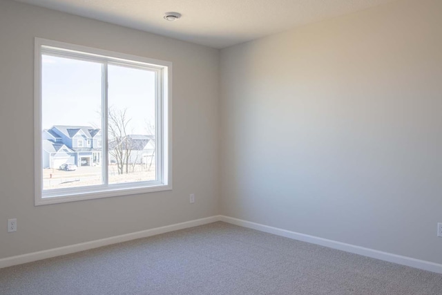 14554 Kingsview Ln N, Dayton, MN 55327 - unfurnished room featuring healthy amount of natural light, carpet floors, and baseboards