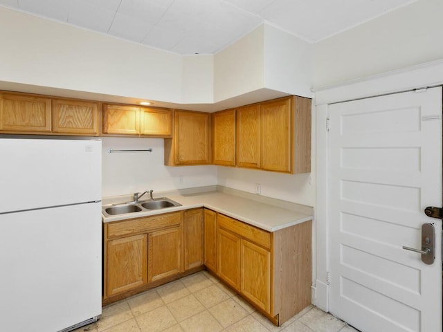 kitchen with white refrigerator and sink