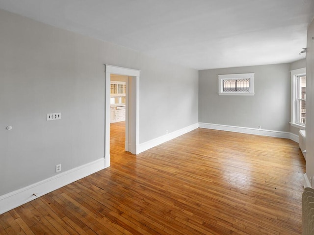 spare room featuring light hardwood / wood-style floors