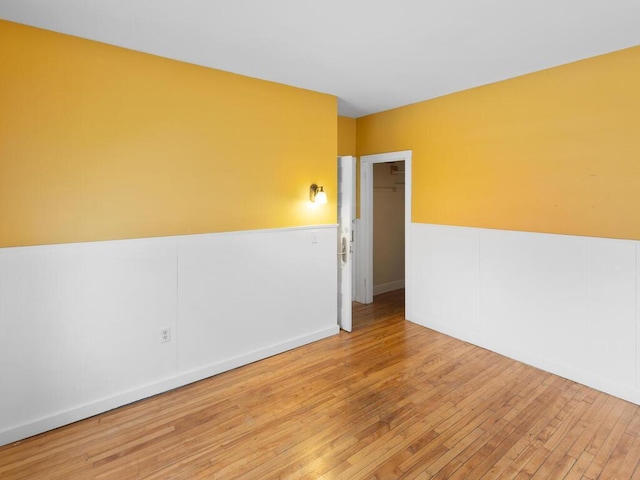 spare room with light hardwood / wood-style flooring