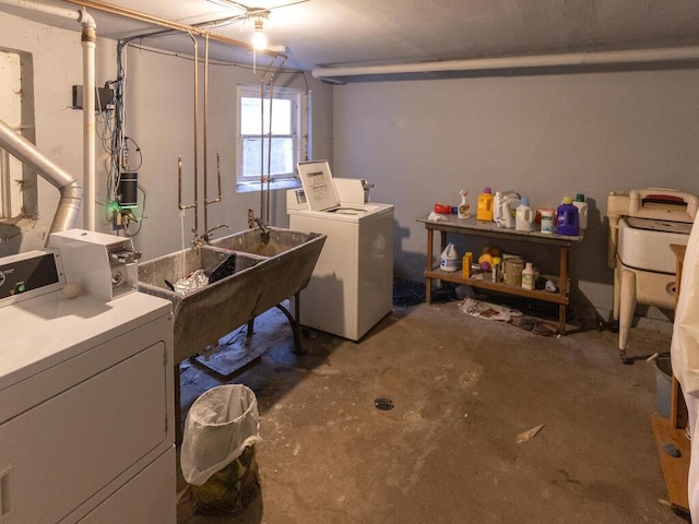 basement with sink and washer and dryer