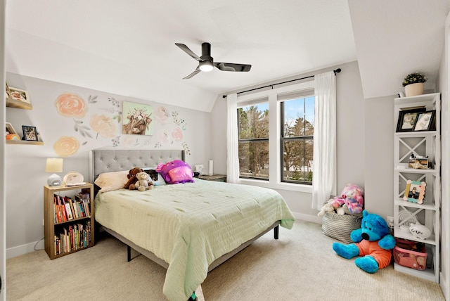 carpeted bedroom with ceiling fan and lofted ceiling