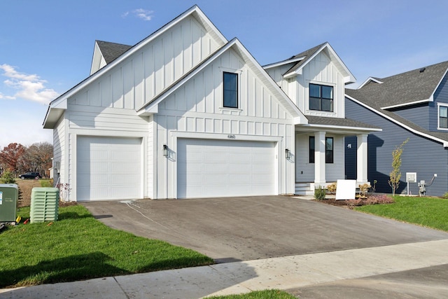 view of front of home with a garage and a front yard