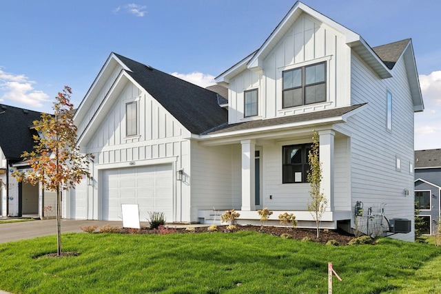 modern farmhouse style home with a garage, a front lawn, and covered porch