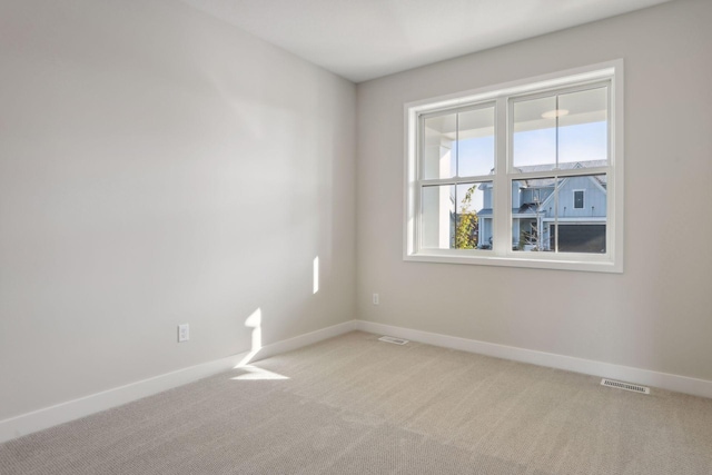 empty room featuring carpet flooring