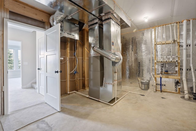 utility room with heating unit