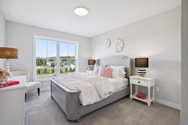 bedroom with light colored carpet