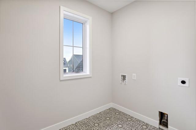 laundry room featuring hookup for an electric dryer and hookup for a washing machine