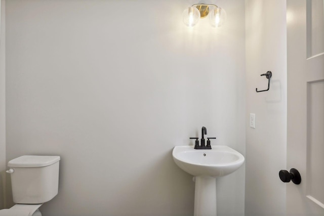 bathroom with toilet and sink