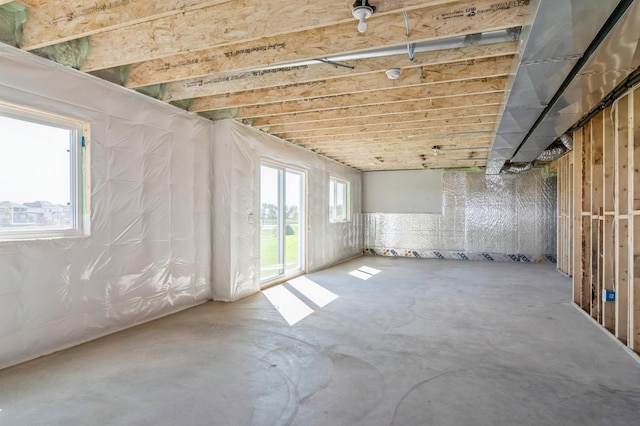 misc room featuring concrete floors and a healthy amount of sunlight